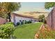 Scenic backyard features lush landscaping, grass, and patio space at 10814 Franklin Hills Ave, Las Vegas, NV 89135