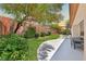 Grassy backyard and covered patio provide a peaceful retreat for relaxing and entertaining at 10814 Franklin Hills Ave, Las Vegas, NV 89135