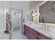 Modern bathroom featuring a double sink vanity, white countertop, and glass-enclosed shower at 10814 Franklin Hills Ave, Las Vegas, NV 89135