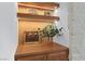 Wood built-in shelving nook with warm lighting at 10814 Franklin Hills Ave, Las Vegas, NV 89135
