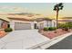 Charming single-story home featuring a two-car garage, mature landscaping, and inviting curb appeal at 10814 Franklin Hills Ave, Las Vegas, NV 89135