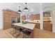 Modern kitchen with stainless steel appliances, a center island with seating, and ample cabinet space at 10814 Franklin Hills Ave, Las Vegas, NV 89135
