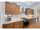 Close-up of a modern kitchen showcasing stainless steel appliances and marble countertops at 10814 Franklin Hills Ave, Las Vegas, NV 89135