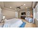 Elegant main bedroom featuring recessed lights, wood floors, a ceiling fan and a cozy seating area at 10814 Franklin Hills Ave, Las Vegas, NV 89135
