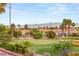 Expansive backyard overlooking a lush green golf course with mountain views in the distance at 11271 Winter Cottage Pl, Las Vegas, NV 89135