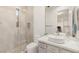 Bathroom featuring a single sink vanity, glass shower and a window at 11271 Winter Cottage Pl, Las Vegas, NV 89135