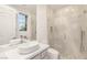 Bathroom featuring a single sink vanity, glass shower and a window at 11271 Winter Cottage Pl, Las Vegas, NV 89135