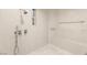 Modern bathroom featuring stylish tile work, shower with bench, and built in niche for storage at 11271 Winter Cottage Pl, Las Vegas, NV 89135