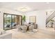 Bright dining room overlooking the pool with modern furnishings and stylish lighting at 11271 Winter Cottage Pl, Las Vegas, NV 89135