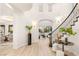 Bright and spacious foyer with a stunning staircase and natural light at 11271 Winter Cottage Pl, Las Vegas, NV 89135