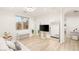 Bright living room featuring white sofa, mirrors and tables at 11271 Winter Cottage Pl, Las Vegas, NV 89135