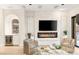 Inviting living room features fireplace, bar, and contemporary decor at 11271 Winter Cottage Pl, Las Vegas, NV 89135