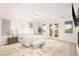 Bright main bedroom features light hardwood floors, fireplace and French doors leading to a balcony at 11271 Winter Cottage Pl, Las Vegas, NV 89135