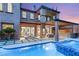 Beautiful pool area with a spa, covered patio, and lush landscaping at 11271 Winter Cottage Pl, Las Vegas, NV 89135