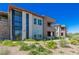 Contemporary multi-story home with stone and stucco, complemented by manicured landscaping at 11280 Granite Ridge Dr # 1009, Las Vegas, NV 89135