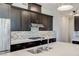 Close-up of a modern kitchen with stainless steel appliances and mosaic backsplash at 11280 Granite Ridge Dr # 1009, Las Vegas, NV 89135