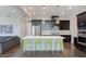 Kitchen with stainless steel appliances, a large island, and stylish green chairs at 11280 Granite Ridge Dr # 1009, Las Vegas, NV 89135