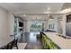 Open-concept living space with hardwood floors and a sleek kitchen island with counter seating at 11280 Granite Ridge Dr # 1009, Las Vegas, NV 89135
