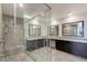 Elegant main bathroom featuring a glass enclosed shower and dual vanities at 11280 Granite Ridge Dr # 1009, Las Vegas, NV 89135