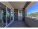 Covered outdoor patio featuring stone pillars, brick flooring, and a view of the greenery at 11280 Granite Ridge Dr # 1009, Las Vegas, NV 89135
