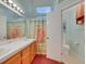 Bright bathroom featuring double sinks, a white countertop, and a shower/tub combination at 1230 Pagentry Dr, North Las Vegas, NV 89031