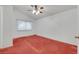 Spacious bedroom with ceiling fan and natural light at 1230 Pagentry Dr, North Las Vegas, NV 89031