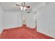 Large bedroom showcasing ceiling fan and doorway to adjoining room at 1230 Pagentry Dr, North Las Vegas, NV 89031