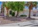 Single-story home displaying low-maintenance landscaping and a neutral color scheme at 1230 Pagentry Dr, North Las Vegas, NV 89031