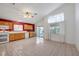 Bright kitchen featuring light wood cabinets and tiled floor at 1230 Pagentry Dr, North Las Vegas, NV 89031