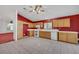Bright kitchen featuring light wood cabinets and tiled floor at 1230 Pagentry Dr, North Las Vegas, NV 89031