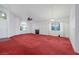Bright living room with a fireplace and arched windows at 1230 Pagentry Dr, North Las Vegas, NV 89031