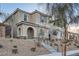 Inviting two-story home with stone accents, covered entry, and landscaped front yard in a desirable neighborhood at 1328 Graphite Ave, Henderson, NV 89002