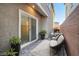 Private outdoor patio area with modern pavers, comfortable seating, and potted plants for relaxation at 1328 Graphite Ave, Henderson, NV 89002