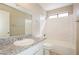 Bathroom features tub with granite vanity at 1345 Stokes St, Las Vegas, NV 89110