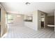 Sunny dining area featuring tile flooring, natural light, and open access to kitchen at 1345 Stokes St, Las Vegas, NV 89110