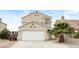 Charming two-story home with a well-manicured lawn and a two-car garage at 1345 Stokes St, Las Vegas, NV 89110
