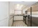 Well-lit kitchen with stainless steel appliances, and granite countertops at 1345 Stokes St, Las Vegas, NV 89110