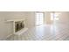 Bright living room featuring a fireplace, tile flooring and a sliding glass door at 1345 Stokes St, Las Vegas, NV 89110