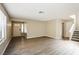 Spacious open-concept living room with hardwood flooring, great natural light, and stairs at 1345 Stokes St, Las Vegas, NV 89110