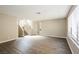 Bright, open living area featuring wood floors and staircase at 1345 Stokes St, Las Vegas, NV 89110