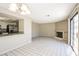 Open-concept area featuring tile flooring, a fireplace and sliding glass doors to the exterior at 1345 Stokes St, Las Vegas, NV 89110