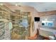 Modern bathroom features glass shower, tub, vanity and lovely design at 144 Desert Valley Dr, Boulder City, NV 89005