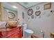 Charming powder room with decorative mirrors and an ornate red vanity with a unique vessel sink at 144 Desert Valley Dr, Boulder City, NV 89005