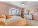 Charming bedroom features a cozy bed, natural light, and stylish decor at 144 Desert Valley Dr, Boulder City, NV 89005