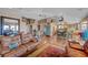 Open-concept living area with hardwood floors, a kitchen island, and comfortable seating at 144 Desert Valley Dr, Boulder City, NV 89005