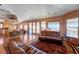 Cozy living room with hardwood floors, comfortable seating, and large windows showcasing the view at 144 Desert Valley Dr, Boulder City, NV 89005