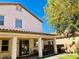 Exterior view of the backyard featuring a covered patio and lush landscaping at 147 Augusta Course Ave, Las Vegas, NV 89148
