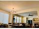 Spacious dining area adjacent to the kitchen featuring a chandelier and natural light at 147 Augusta Course Ave, Las Vegas, NV 89148