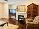 Cozy living area with fireplace and a classic armoire, perfect for relaxation at 147 Augusta Course Ave, Las Vegas, NV 89148