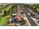 This aerial view shows a neighborhood with a golf course and desert landscaping at 1587 Bermuda Dunes Dr, Boulder City, NV 89005